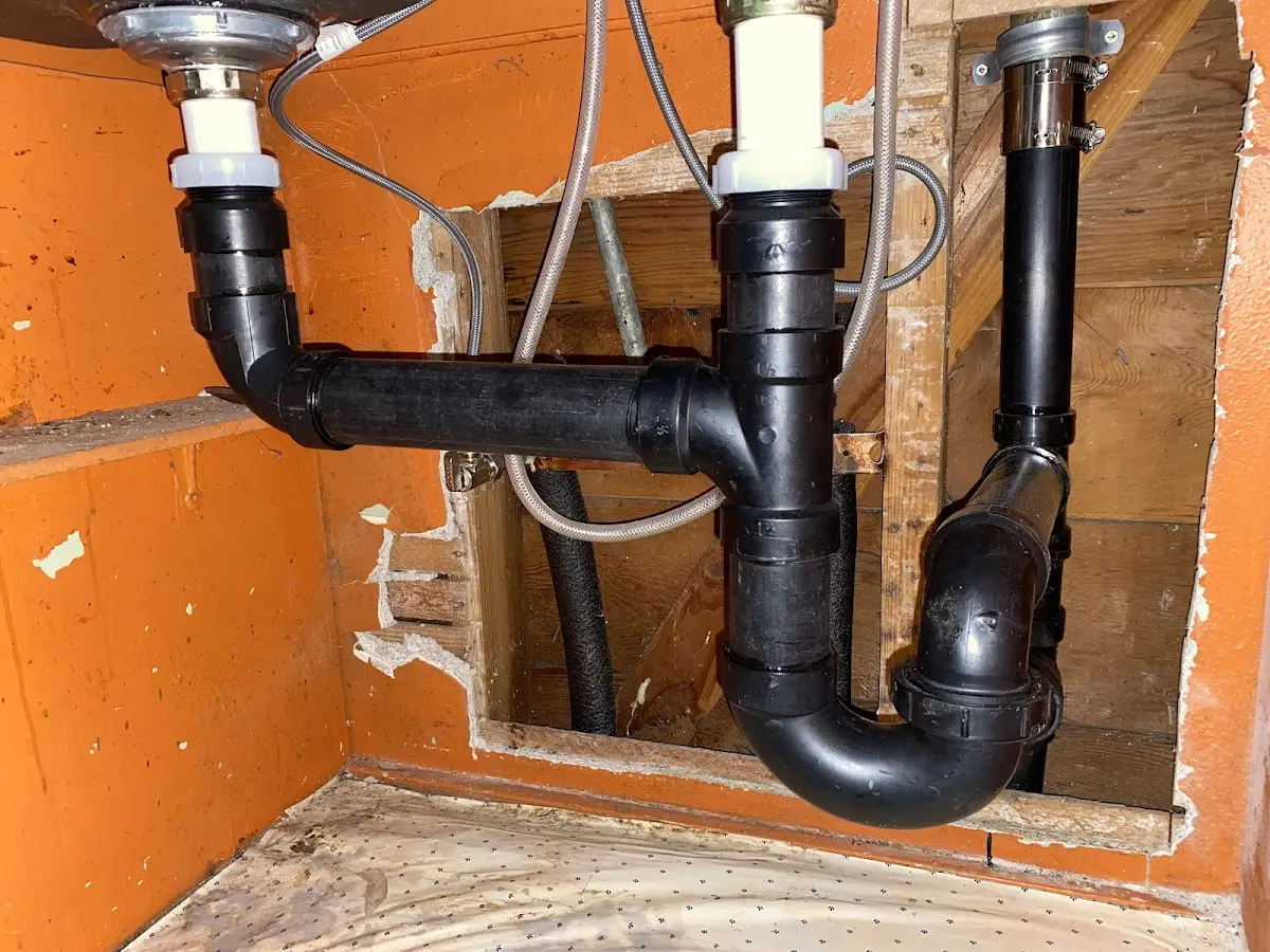 Professional Garbage Disposal Repair equipment and tools on the job in White City